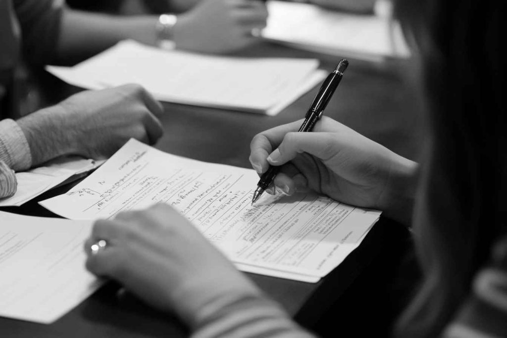 Structured interview panel evaluating a candidate using standardized questions.