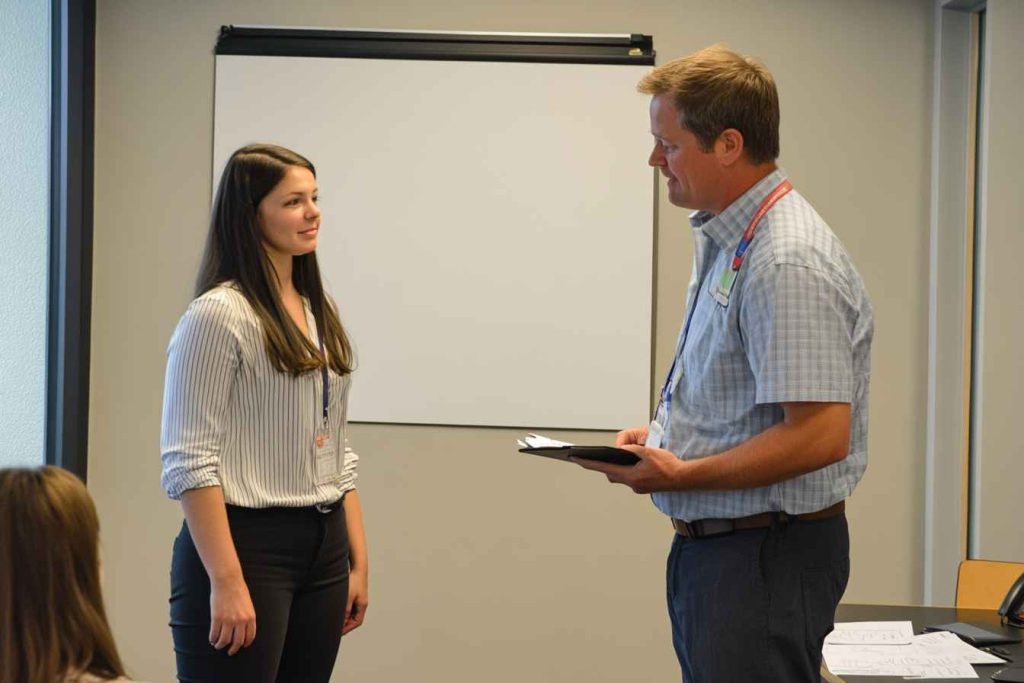 Candidate Assessment and Grading Policy and Procedure: Your Complete Guide to Fair Hiring 3 Candidate performing a job simulation as part of an assessment.