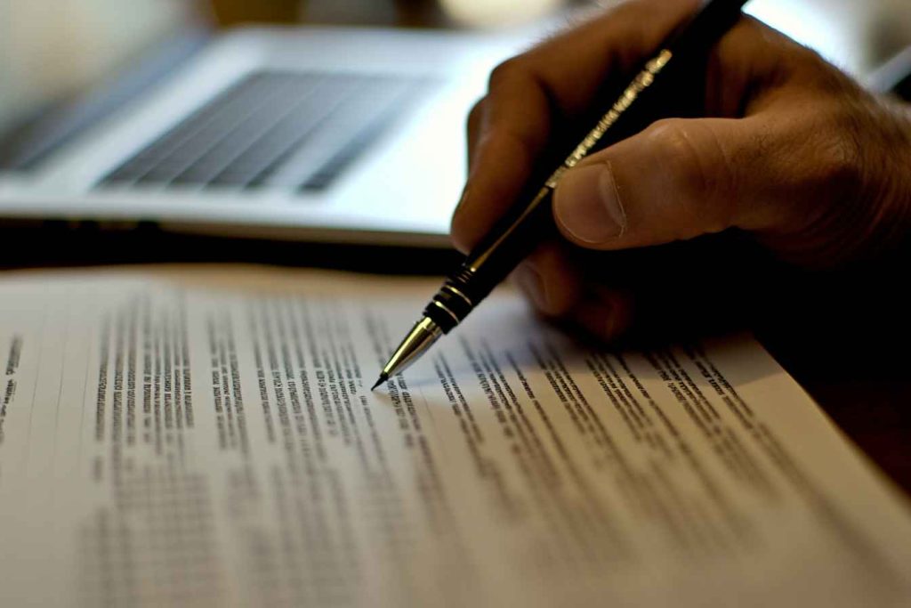 attention-to-detail-test Man identifying inconsistencies between printed and digital data reports