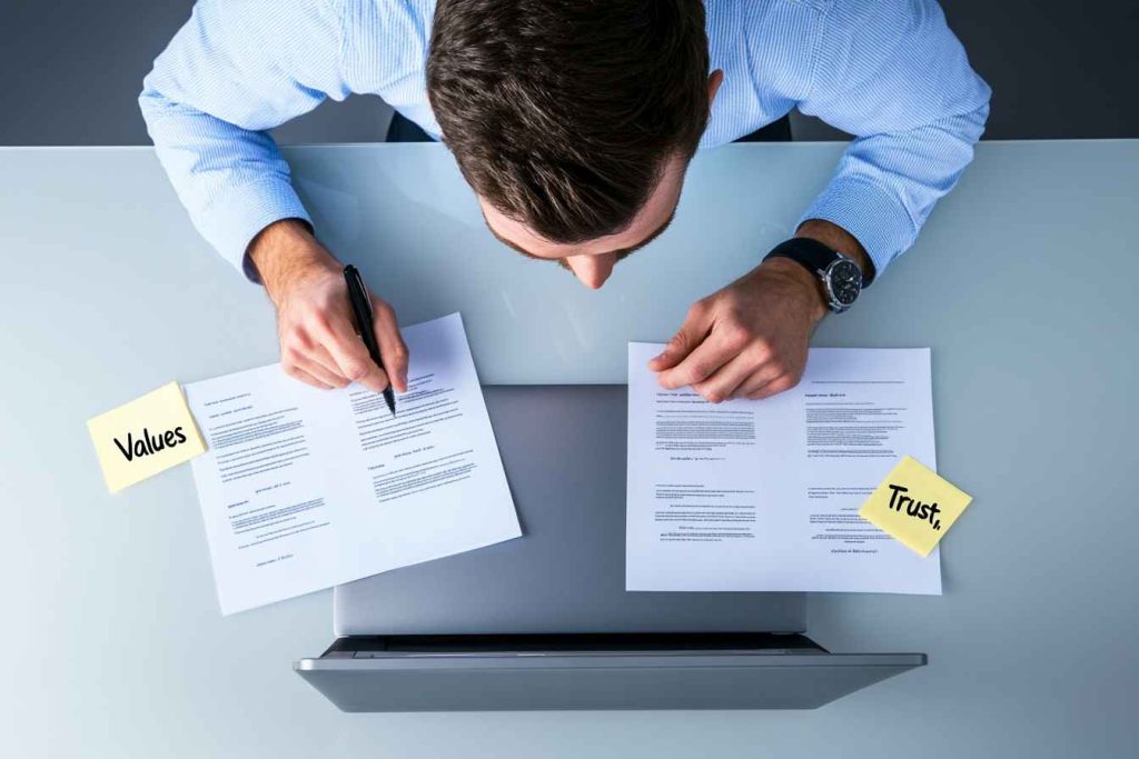hiring-for-character-not-just-skill A male recruiter choosing between two qualified candidates based on integrity—not just qualifications.