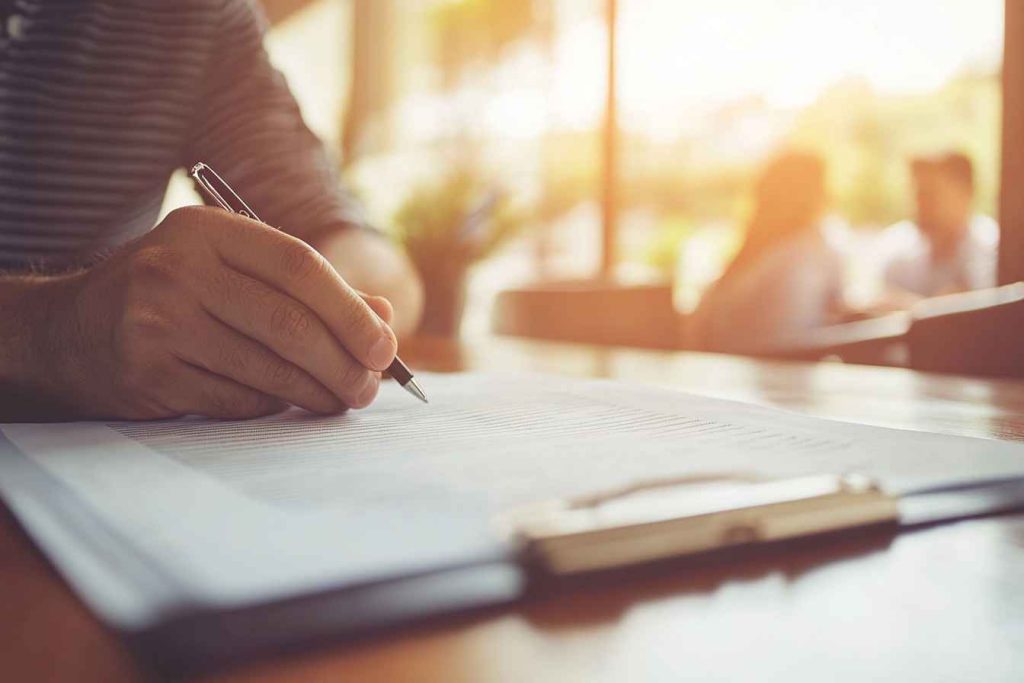 structured-behavioral-interview Male interviewer using structured conflict resolution questions in a hiring process.