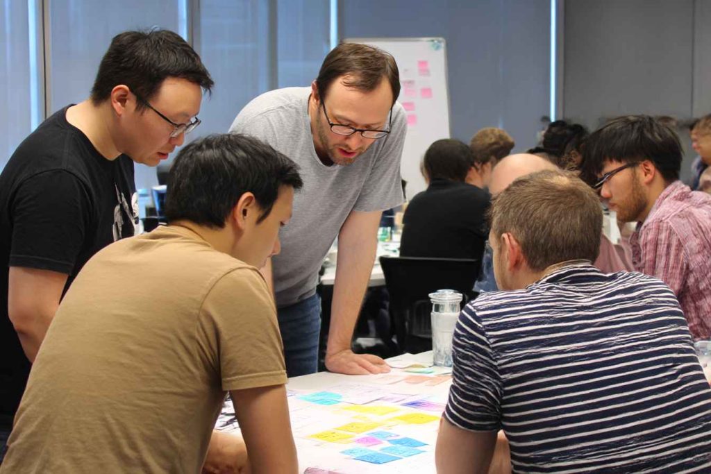 Team members reviewing their quick test results during a workshop