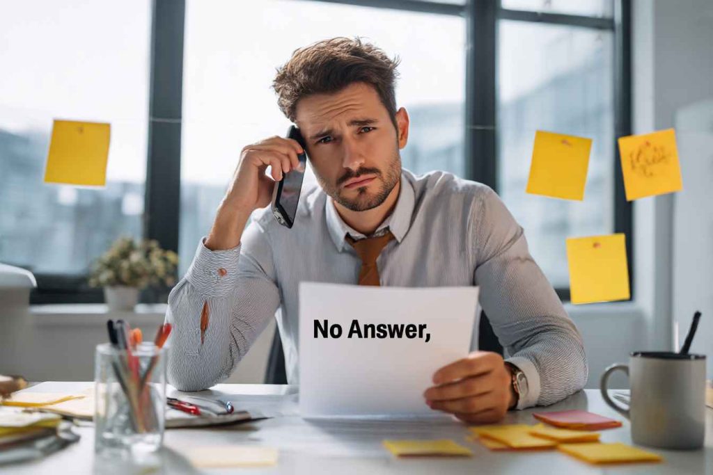 A recruiter visibly frustrated while calling references with no response