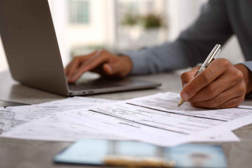 HR professional completing Form I-9 to verify employee eligibility.